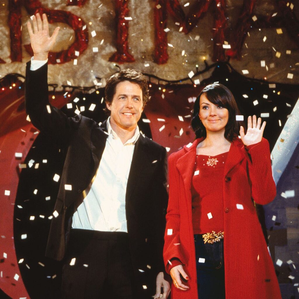 Hugh Grant at Christmas performance in the Christmas movie Love Actually