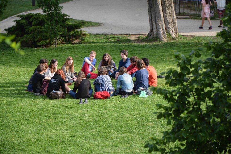 group of college age people in a park