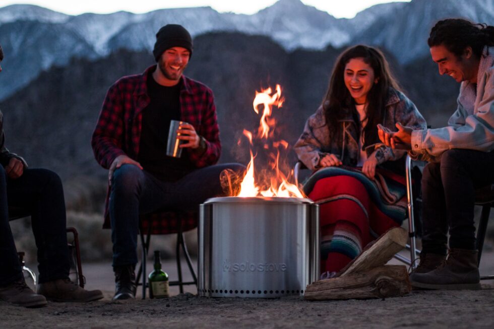 friends around the fire camping