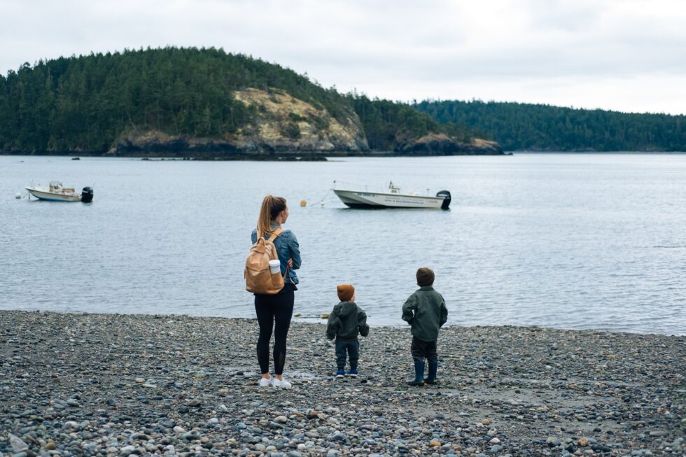 mother and sons at a lake