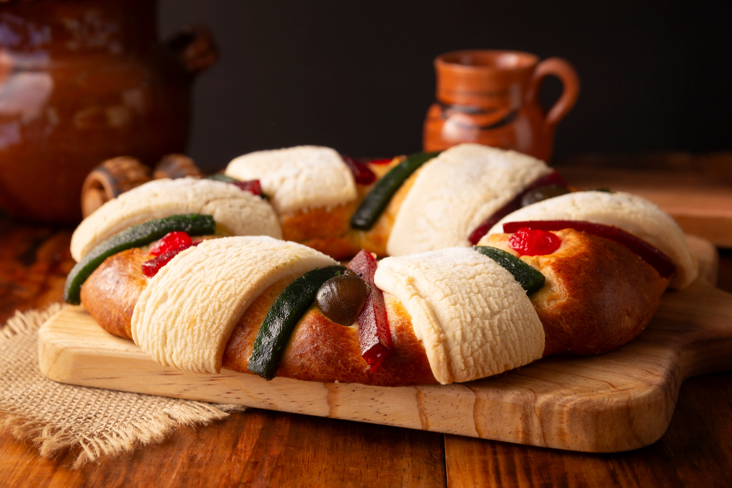 Three Kings Bread also called Rosca de Reyes, Roscon, Epiphany Cake, traditionally served with hot chocolate in a clay Jarrito. Mexican tradition on January 5th.